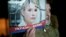A supporter of Yulia Tymoshenko holds up her picture during a rally in Kyiv in November.