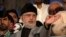 Pakistani opposition cleric Mohammad Tahir ul-Qadri addresses his supporters outside the parliament building in Islamabad on August 21.