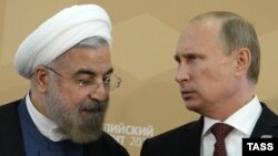 از راست: پوتین و روحانی، رئیسان جمهوری روسیه و ایران، طی دیداری سپتامبر ۲۰۱۴