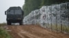 Poland has sent thousands of soldiers to its borders and also started building a barbed-wire fence.