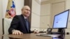 Russian President Vladimir Putin casts his vote online in the presidential election on March 15. By all estimates, the repression of dissenting voices will only increase in the wake of Putin's reelection. 