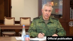 Armenia -- Lieutenant-General Rustam Muradov, the commander of Russian peacekeepering forces stationed in Nagorno-Karabakh, meets with Armenian Defense Minister Vagharshak Harutiunian, Yerevan, February 10, 2021.