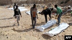 The bodies of 74 migrants who drowned in the Mediterranean trying to reach Europe after they washed up on a beach near Zawiyah on Libya’s northern coast, in February 2017.