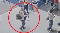 O captură de ecran dintr-un videoclip difuzat de agenția de securitate rusă FSB arată un presupus suspect într-un atac armat asupra locotenentului general Vladimir Alekseev. 