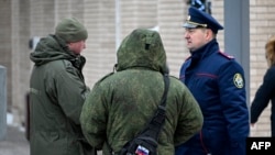 Investigators work at the site of an explosion that killed Igor Kirillov, a high-ranking Russian general, and his assistant in Moscow on December 17. 