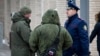 Investigators work at the blast scene, which killed the commander of Russian armed forces' chemical, biological and radiation defence troops, Igor Kirillov, and his assistant, according to the Russian Investigative Committee, outside a residential buildin