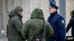 Investigators work at the site of an explosion that killed Igor Kirillov, a high-ranking Russian general, and his assistant in Moscow on December 17. 