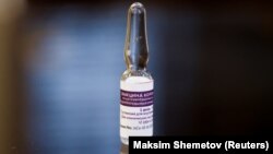 A preproduction sample vial of Russia's third COVID-19 vaccine, CoviVac, is pictured at the Chumakov Center in Moscow