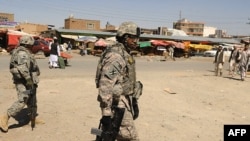 U.S. soldiers patrol the streets of Kabul earlier this month