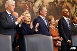 (L-R) Former U.S. President Bill Clinton, former U.S. Secretary of State Hillary Clinton, former U.S. President George W. Bush, former first lady Laura Bush and former U.S. President Barack Obama attend the inauguration of Donald Trump.