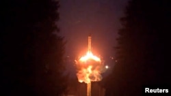 A still image from a video released by the Russian Defense Ministry shows what it said is a Yars intercontinental ballistic missile being test-launched at the Plesetsk Cosmodrome on October 25.