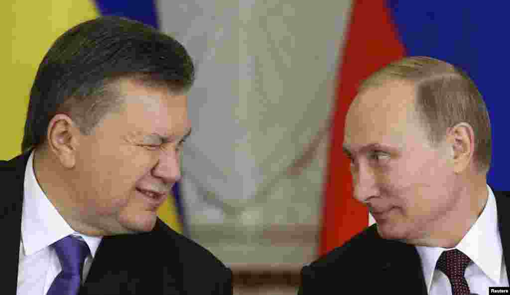 Ukrainian President Viktor Yanukovych (left) gives a wink to his Russian counterpart Vladimir Putin during a signing ceremony after a meeting of the Russian-Ukrainian Interstate Commission at the Kremlin in Moscow, on December 17. (Reuters/Sergei Karpukhin)