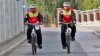 Nadir Shah Nangarhari and his son Feruz Khan, seen here in Prague, are pedaling across Europe and the United States to raise awareness about the problems still plaguing their country.