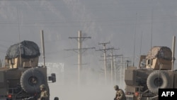 U.S. soldiers keep watch during gunfire near a U.S. base in Kandahar on October 27.