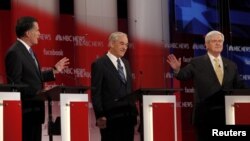 Republican presidential candidates (left to right) Mitt Romney, Ron Paul, and Newt Gingrich participate in a Republican presidential-candidate debate in Concord, New Hampshire, on January 8.