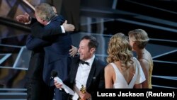 U.S. -- 90th Academy Awards - Oscars Show - Hollywood, California, U.S., 04/03/2018 - Bryan Fogel (C) and Dan Cogan (L) win for the Best Documentary Feature Oscar for Icarus.