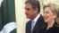 U.S. Secretary of State Hillary Clinton and her Pakistani counterpart, Shah Mehmood Qureshi, arrive for a meeting at the State Department in Washington today.