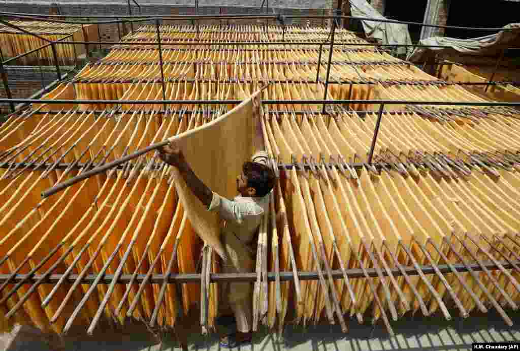 A vendor arranges traditional vermicelli noodles at a factory in Lahore, Pakistan. (AP/K.M. Chaudary)