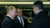 Russia - President Vladimir Putin and Prime Minister Dmitry Medvedev talk to Armenian Prime Minister Tigran Sarkisian, Sochi, 23Feb2014.