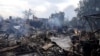 Destroyed buildings smolder in a residential area of the Kyiv suburb of Vyshneve following Russian missile and drone strikes on the Ukrainian capital on July 6. 