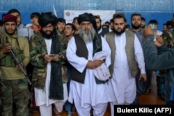 The Taliban's head of physical education and sports, Bashir Ahmad Rustamzai, arrives to watch youths performing their skills during an event in Kabul on September 14.
