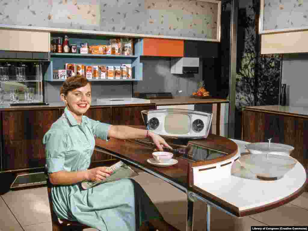 A woman demonstrates a model kitchen made for the exhibition. During the debates, Nixon noted that conveniences like dishwashers made life &ldquo;more easy for our housewives,&rdquo; to which Khrushchev countered, &ldquo;Your capitalistic attitude toward women does not occur under communism.&rdquo; &nbsp;