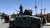 Afghan security forces patrol along a road in the city of Ghazni, August 14, 2018. File photo