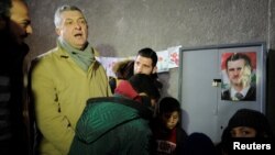 United Nations High Commissioner for Refugees Filippo Grandi visits a shelter for displaced Syrians in Jibreen, on the outskirts of Aleppo, on February 1.