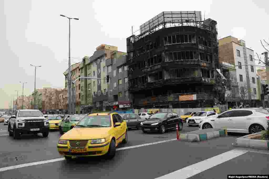A torched building in Tehran that was linked to Ayandah Bank, a company that collapsed in October amid corruption allegations.Some observers say the bank's demise contributed to the economic storm that precipitated the mass protests.