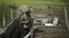 Nagorno-Karabakh -- An ethnic Armenian soldier stands guard in a trench at artillery positions near the Nagorno-Karabakh's town of Martuni, April 7, 2016