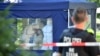 German police officers investigate the crime scene where Tornike Kavtarashvili was fatally shot in the head in Berlin in August 2019. 