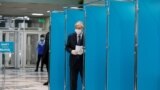 Kazakh President Qasym-Zhomart Toqaev voting during Kazakhstan's parliamentary elections in Nur-Sultan on January 10.