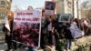 Some 200 Iranian Assyrian Christians take part in a protest in front of the United Nations office in Tehran on March 12.