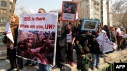 Some 200 Iranian Assyrian Christians take part in a protest in front of the United Nations office in Tehran on March 12.