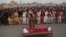People gather to offer funeral prayers by the body of a Pakistani prisoner executed in January 2015. Pakistan lifted a six-year moratorium on the death penalty after militants killed more than 150 people at a school in the northwestern city of Peshawar in December 2014. 