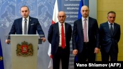 Georgian Prime Minister Mamuka Bakhtadze speaks to reporters on July 12 as he introduces new cabinet members in Tbilisi, including Education Minister Mikheil Batiashvili (right), Economy Minister Giorgi Kobulia (second right) and Finance Minister Vano Machavariani (third right). 