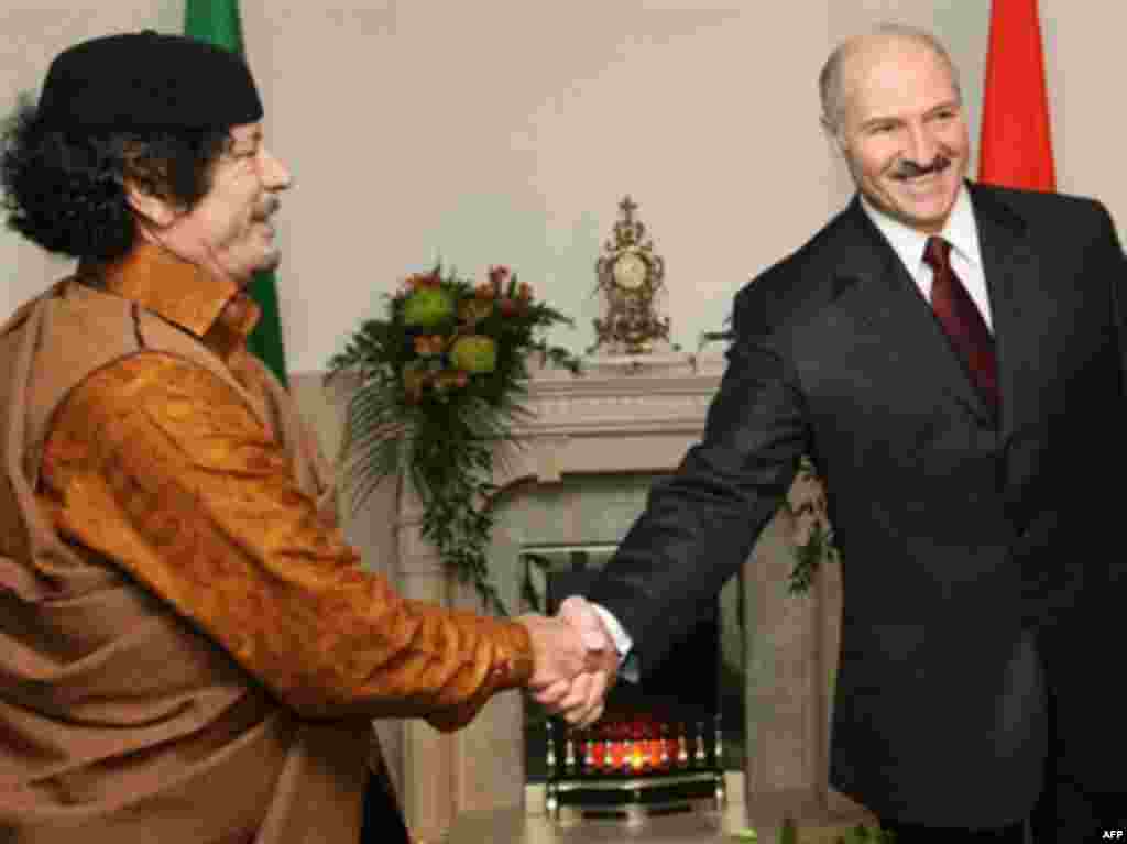 Qaddafi shakes hands with Belarusian President Alyaksandr Lukashenka during the Libyan leader's first visit to Minsk on November 2, 2008.