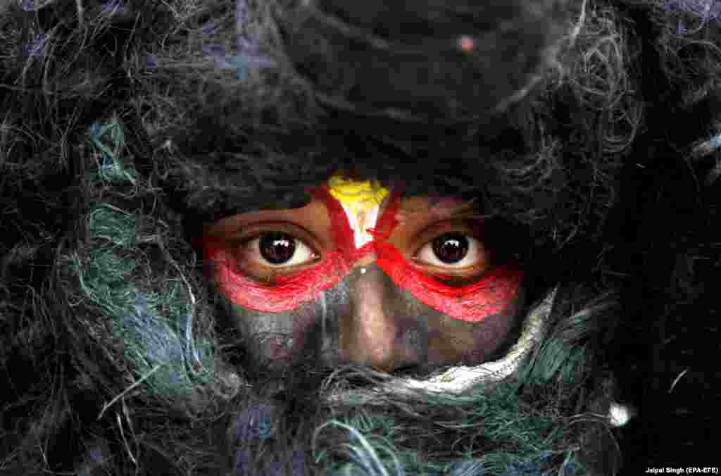 An Indian child dressed as Lord Shiva takes part in the Maha Shivratri procession during the Maha Shivratri festival celebrations in Jammu, the winter capital of Kashmir, India. (epa-EFE/Jaipal Singh)