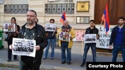 France - French-Armenian activist Schanth Vosgueritchian (L) leads a protest outside the Armenian Embassy in Paris, 28April 2015.