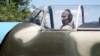 Ukraine - a Ukrainian gunner shoots down Russian drones from Soviet-era Yak-52 propeller planes. screen grab