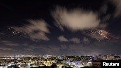 Israel's Iron Dome anti-missile system intercepts rockets as seen from Ashkelon, Israel, on October 1.