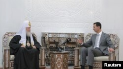 Президент Сирії Башар аль-Асад (п) приймає патріарха Московського Кирила (л), Дамаск, 13 листопада 2011 року