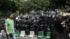 Security guards on the streets around the Iranian parliament in Tehran on June 7.