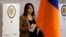 Armenia - A woman votes in parliamentary elections at a polling station in Yerevan, June 7, 2026.