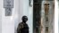 A file photo of a member of the local security forces standing guard outside the offices of the Crimean Tatar's Mejlis in Simferopol. The Tatar community on the Black Sea peninsula have complained of discrimination and harassment since the territory was forcibly annexed by Russia in 2014. 