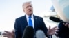 US President Donald Trump speaks to reporters before boarding Air Force One in West Palm Beach, Florida, on March 23.