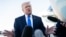 US President Donald Trump speaks to reporters before boarding Air Force One in West Palm Beach, Florida, on March 23.
