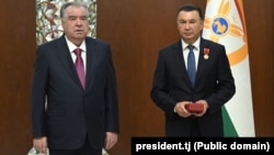 Эмомалӣ Раҳмон ва Қоҳир Расулзода
