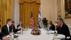 U.S. Secretary of State Antony Blinken (left) meets with Israeli Foreign Minister Yair Lapid in Rome on June 27. 