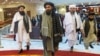 Taliban co-founder Mullah Abdul Ghani Baradar (C) and other members of the Taliban delegation arrive to attend a conference on Afghanistan in Moscow on March 18.